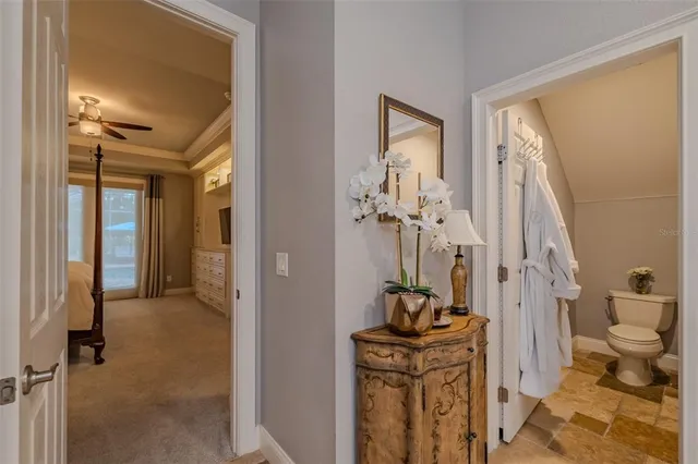 a bedroom with a bed and a refrigerator