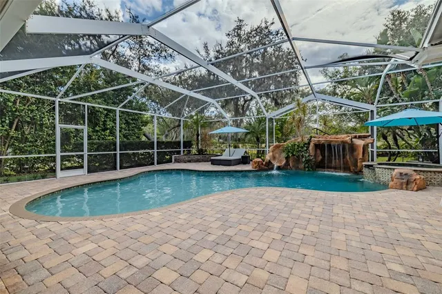 a view of a backyard with swimming pool