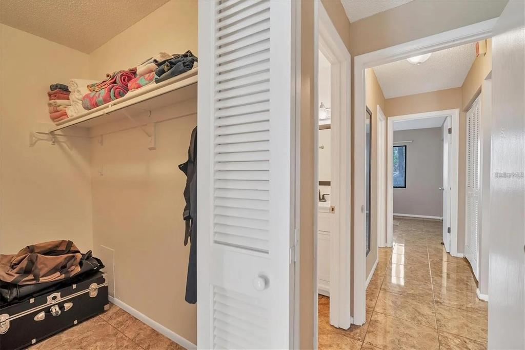1624 Stickney Point Road, Unit 108 Sarasota, FL 34231 - Photo 13 of 39 a very nice looking room with a hallway