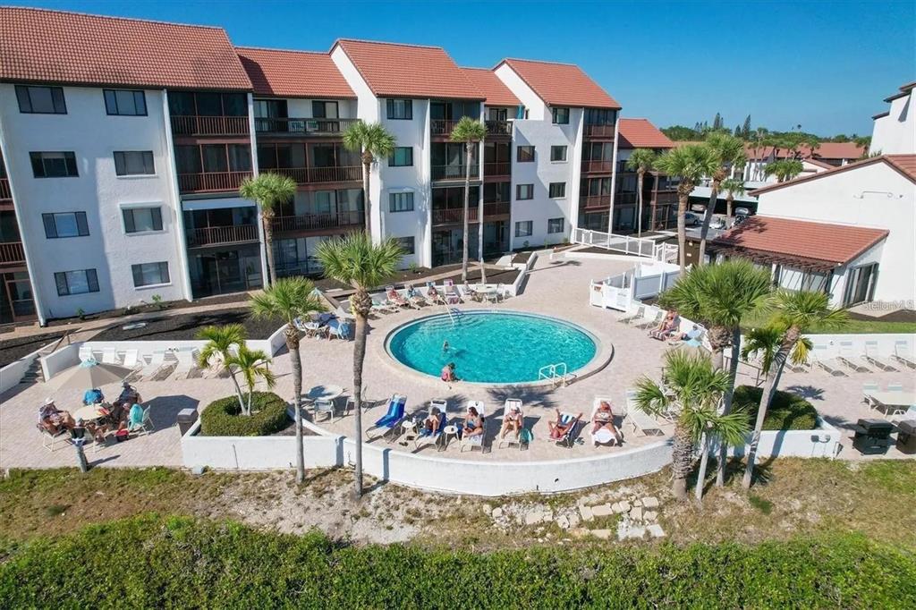 1624 Stickney Point Road, Unit 108 Sarasota, FL 34231 - Photo 15 of 39 a view of a swimming pool with a patio