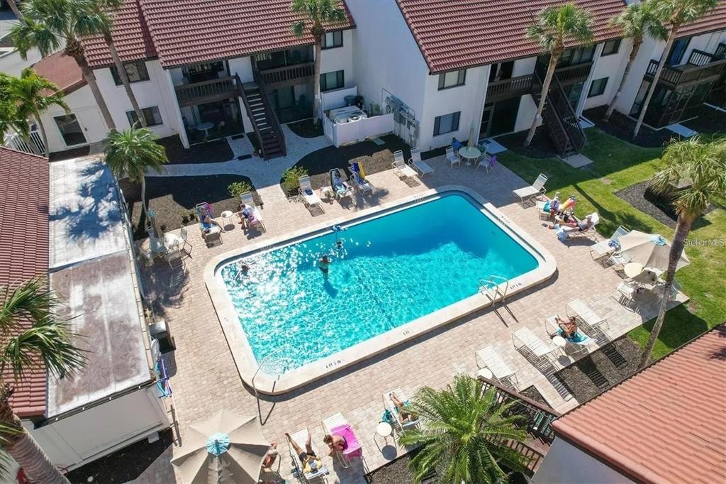 1624 Stickney Point Road, Unit 108 Sarasota, FL 34231 - Photo 16 of 39 an outdoor view of a house with garden