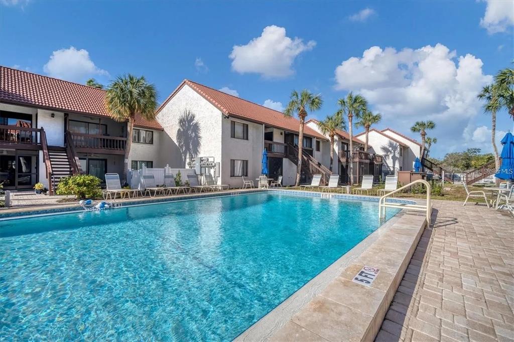 1624 Stickney Point Road, Unit 108 Sarasota, FL 34231 - Photo 17 of 39 a view of a house with swimming pool