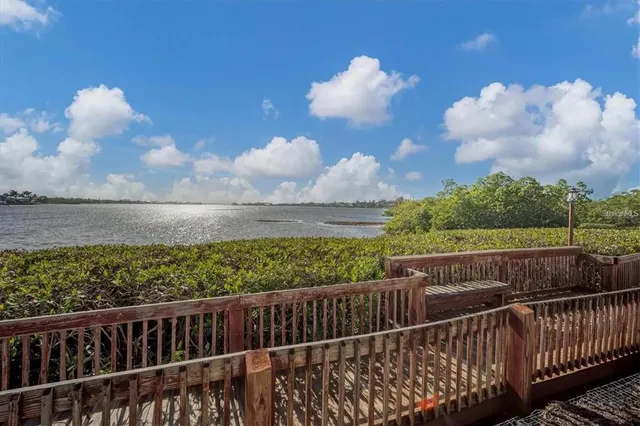 an aerial view of a house with a lake view