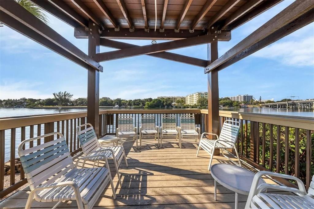 1624 Stickney Point Road, Unit 108 Sarasota, FL 34231 - Photo 25 of 39 a view of a balcony with wooden floor