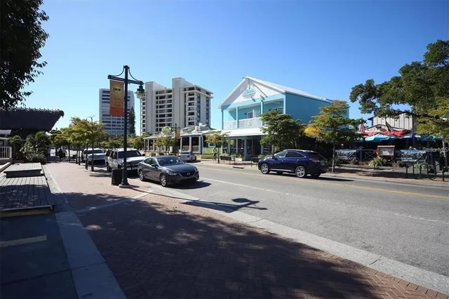a row of car parked on the side of the road