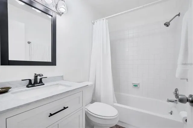 a bedroom with double bed and a window