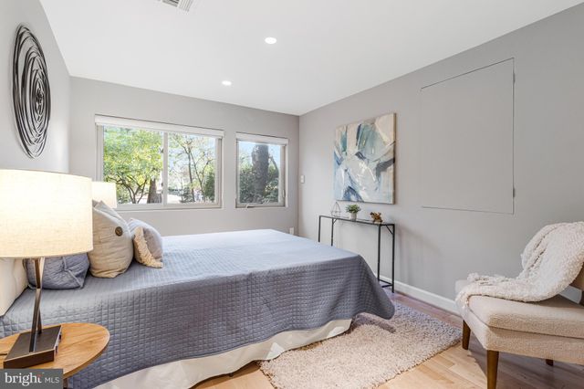 a view of a patio with table and chairs with wooden floor and fence