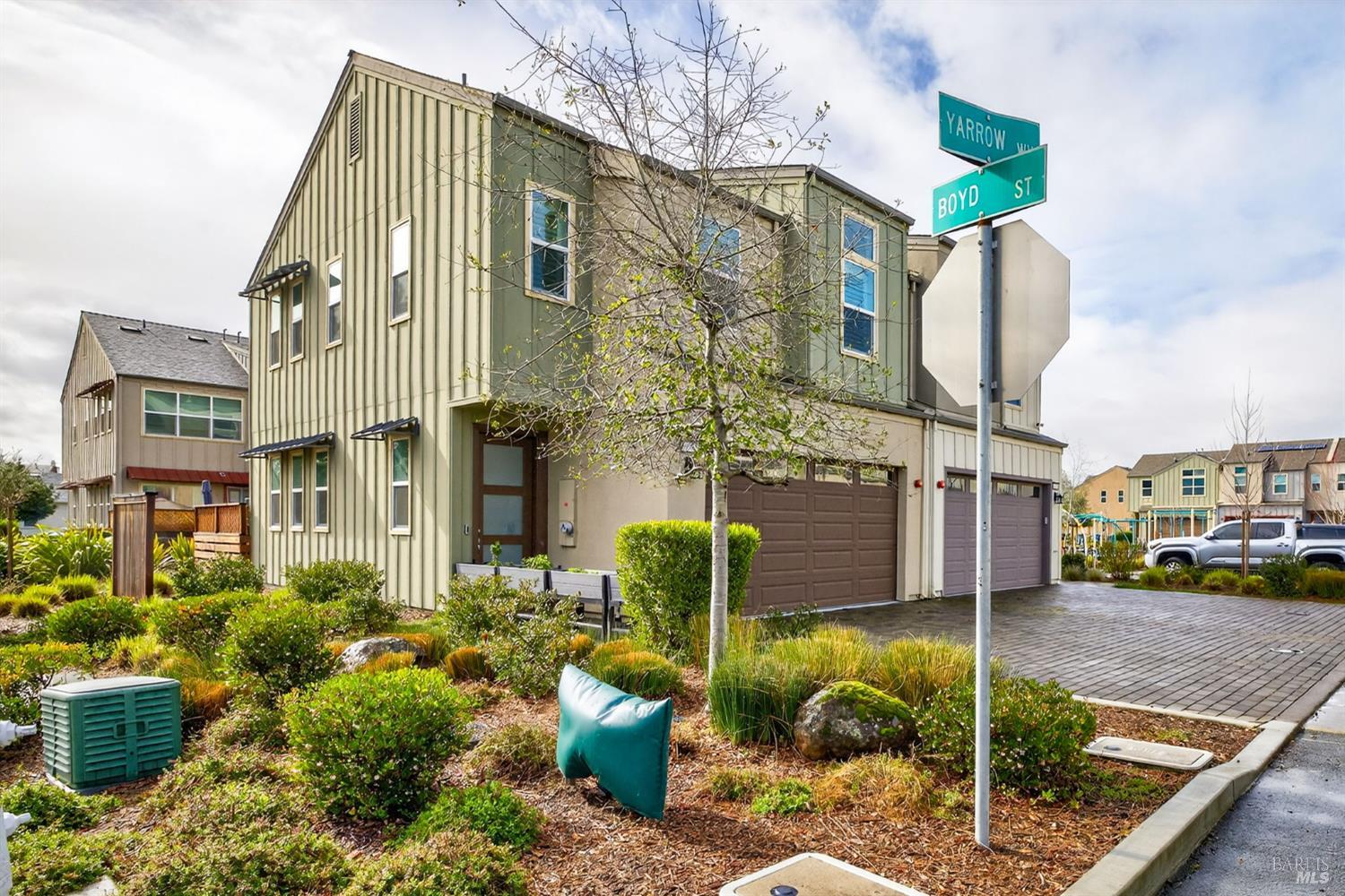 a front view of a house with garden