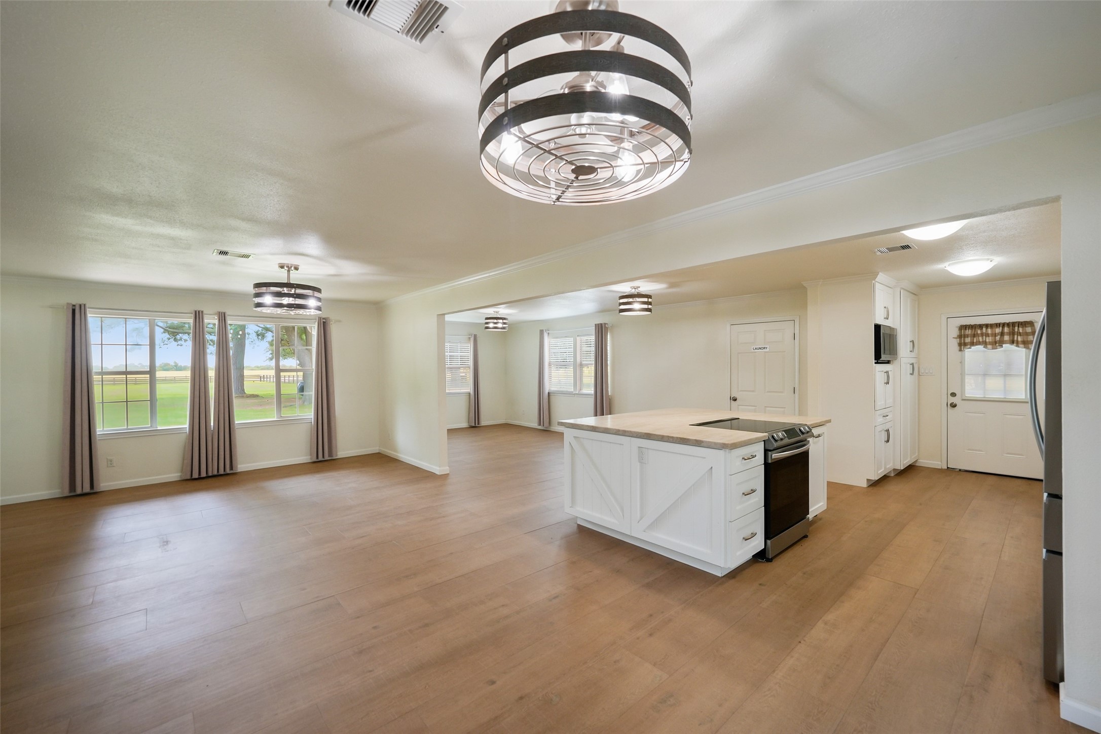 19635 Kermier Road Waller, TX 77484 - Photo 27 of 27 Spacious open floor plan offers seamless flow between the kitchen, dining, and living areas.