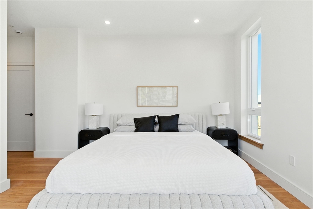 58 Kent, Unit 303 Brookline, MA 02445 - Photo 37 of 41 a bedroom with a bed and a painting