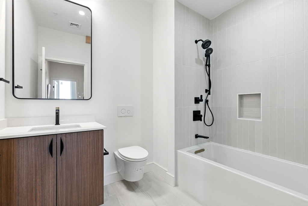 58 Kent, Unit 303 Brookline, MA 02445 - Photo 41 of 41 a bathroom with a toilet sink and bathtub