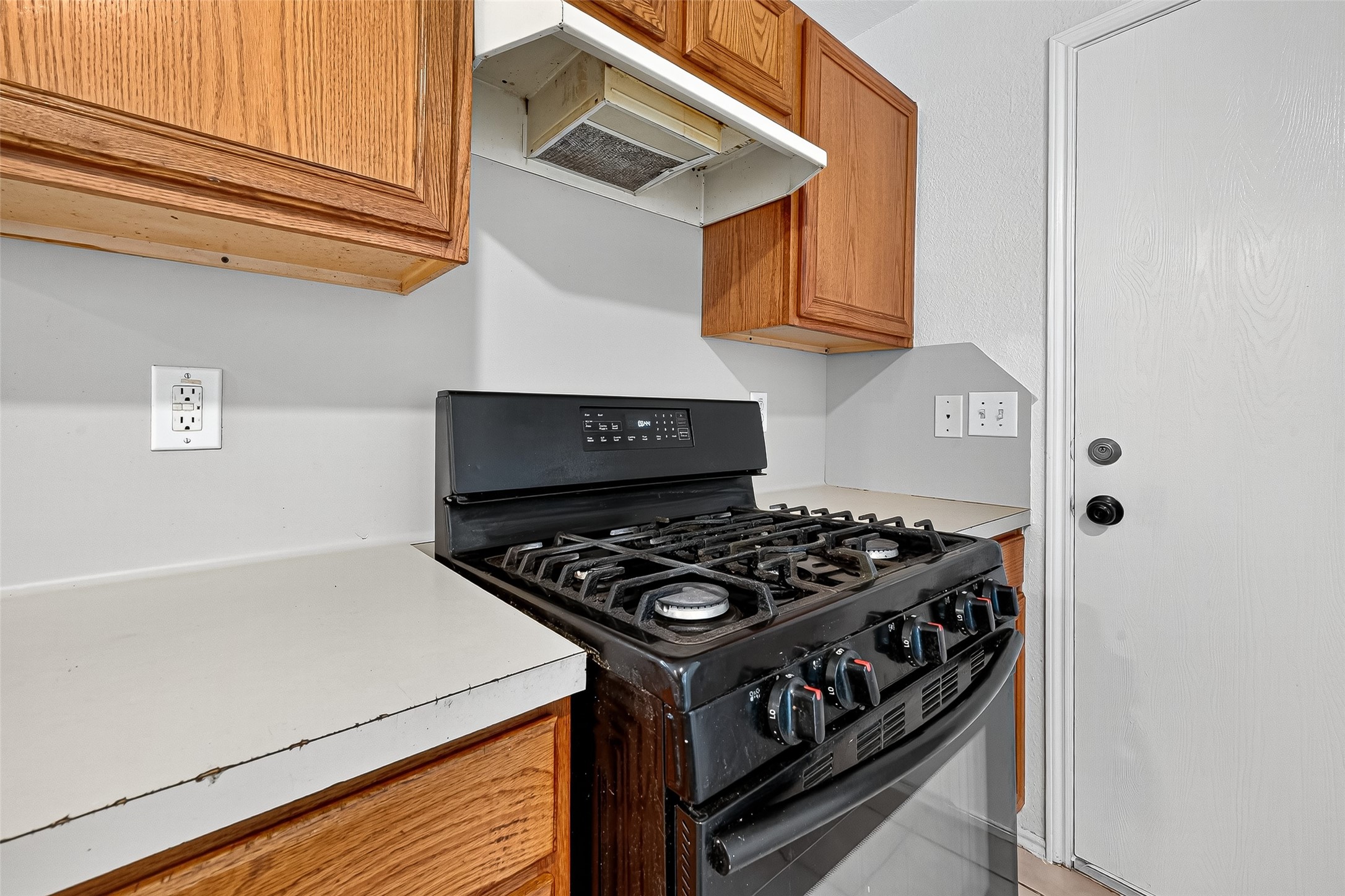 22819 Cabanna Road Spring, TX 77389 - Photo 9 of 26 a kitchen with a stove and a microwave