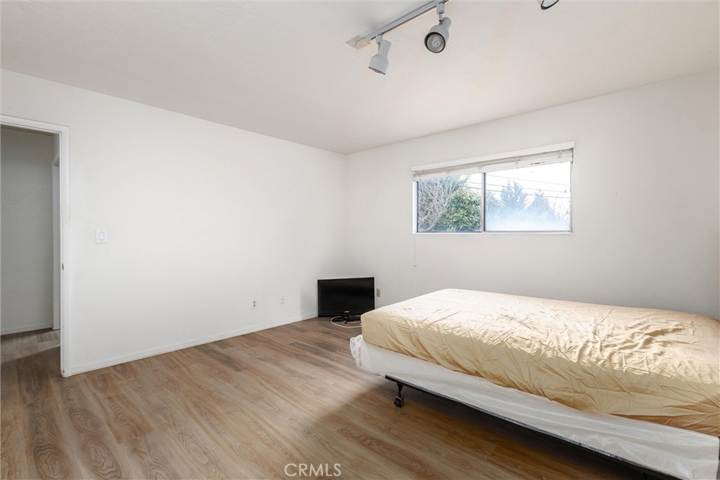 369 Dunbar Street Morro Bay, CA 93442 - Photo 10 of 22 a bedroom with a bed and a window