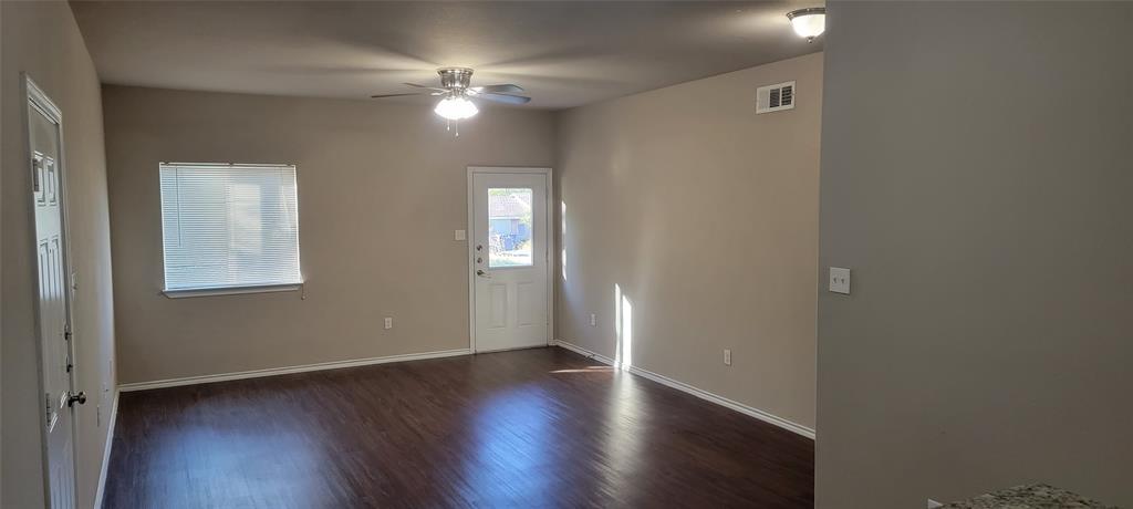 516 East Hazelwood Street, Unit A Princeton, TX 75407 - Photo 2 of 13 Foyer with dark wood-type flooring and a ceiling fan