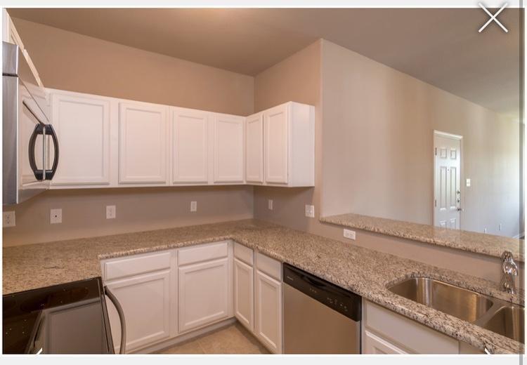 516 East Hazelwood Street, Unit A Princeton, TX 75407 - Photo 4 of 13 Kitchen featuring light stone countertops, and light tile patterned flooring