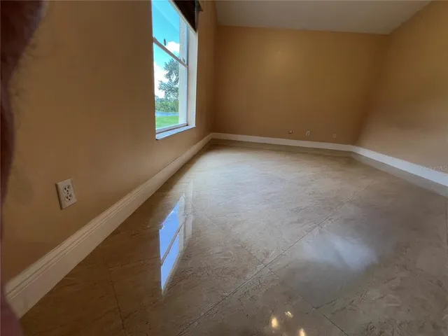 a view of an empty room and window