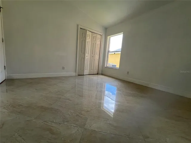 an empty room with windows