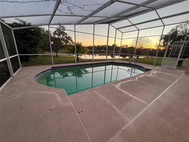 a view of a swimming pool with a porch