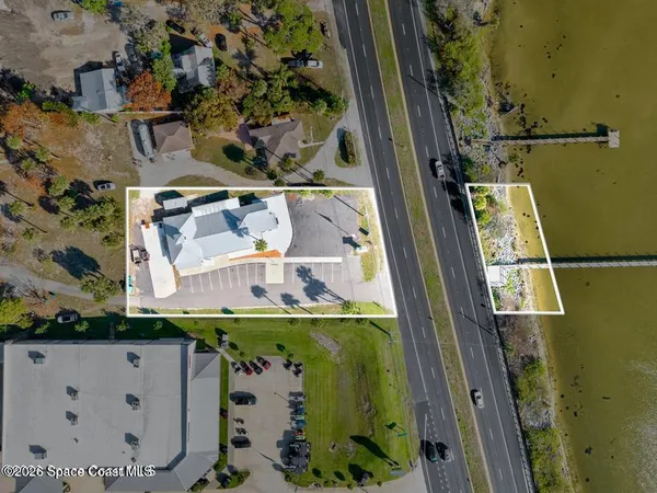 an aerial view of a house with a swimming pool