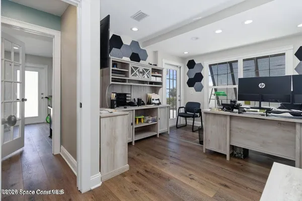 a workspace with furniture and wooden floor
