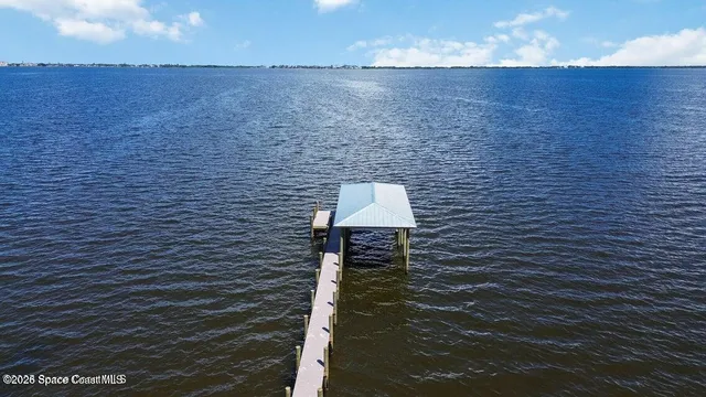 a view of a lake with a building in the background