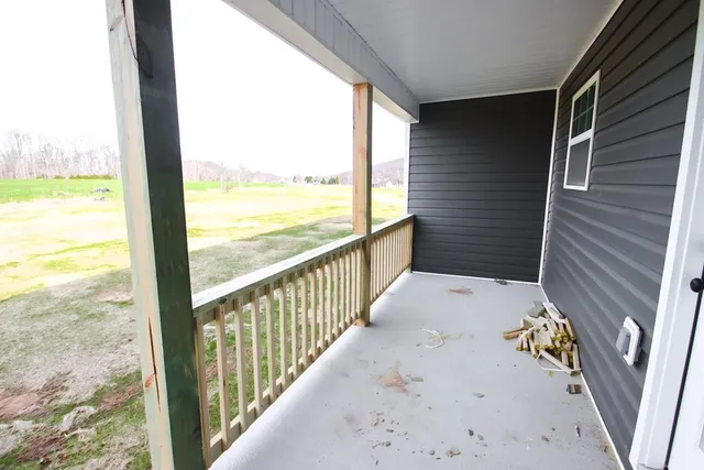 a view of balcony with furniture