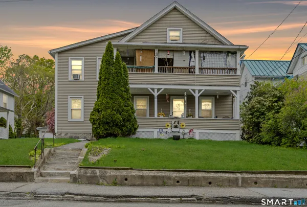 front view of a house with a yard