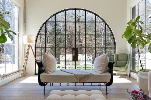 a living room with furniture and a window