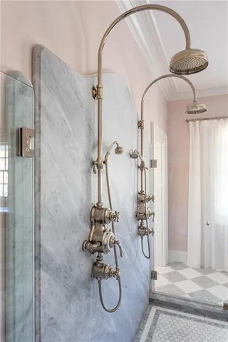 a bathroom with a glass shower door