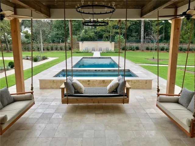 a view of swimming pool with a sitting area