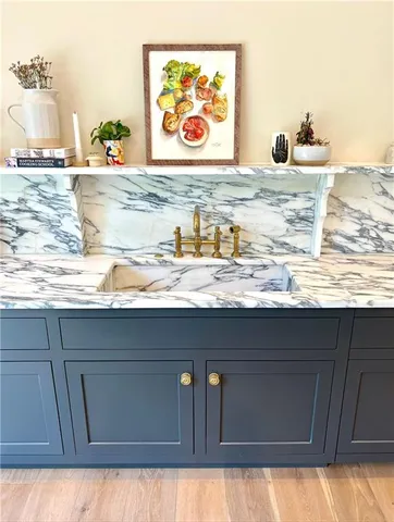 a view of kitchen sink and cabinet