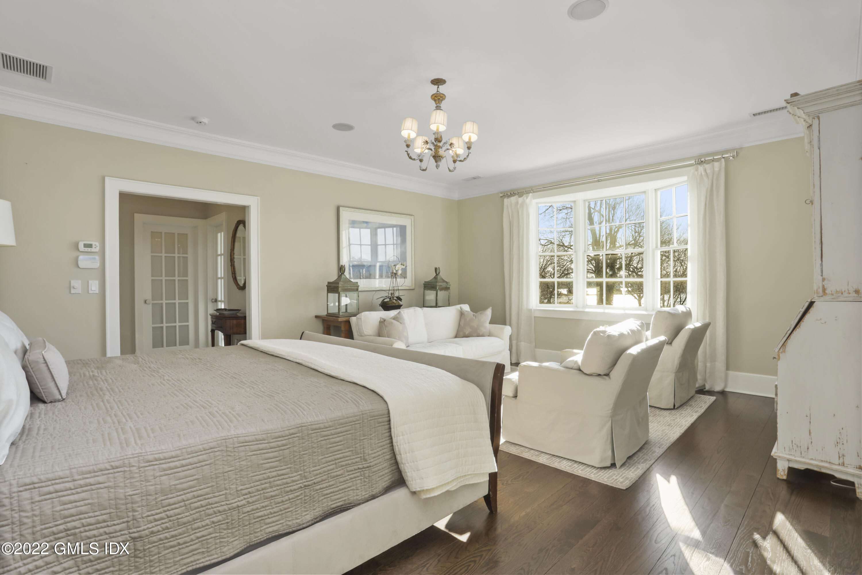 30 Bayside Terrace Riverside, CT 06878 - Photo 25 of 50 a spacious bedroom with a bed and a large window