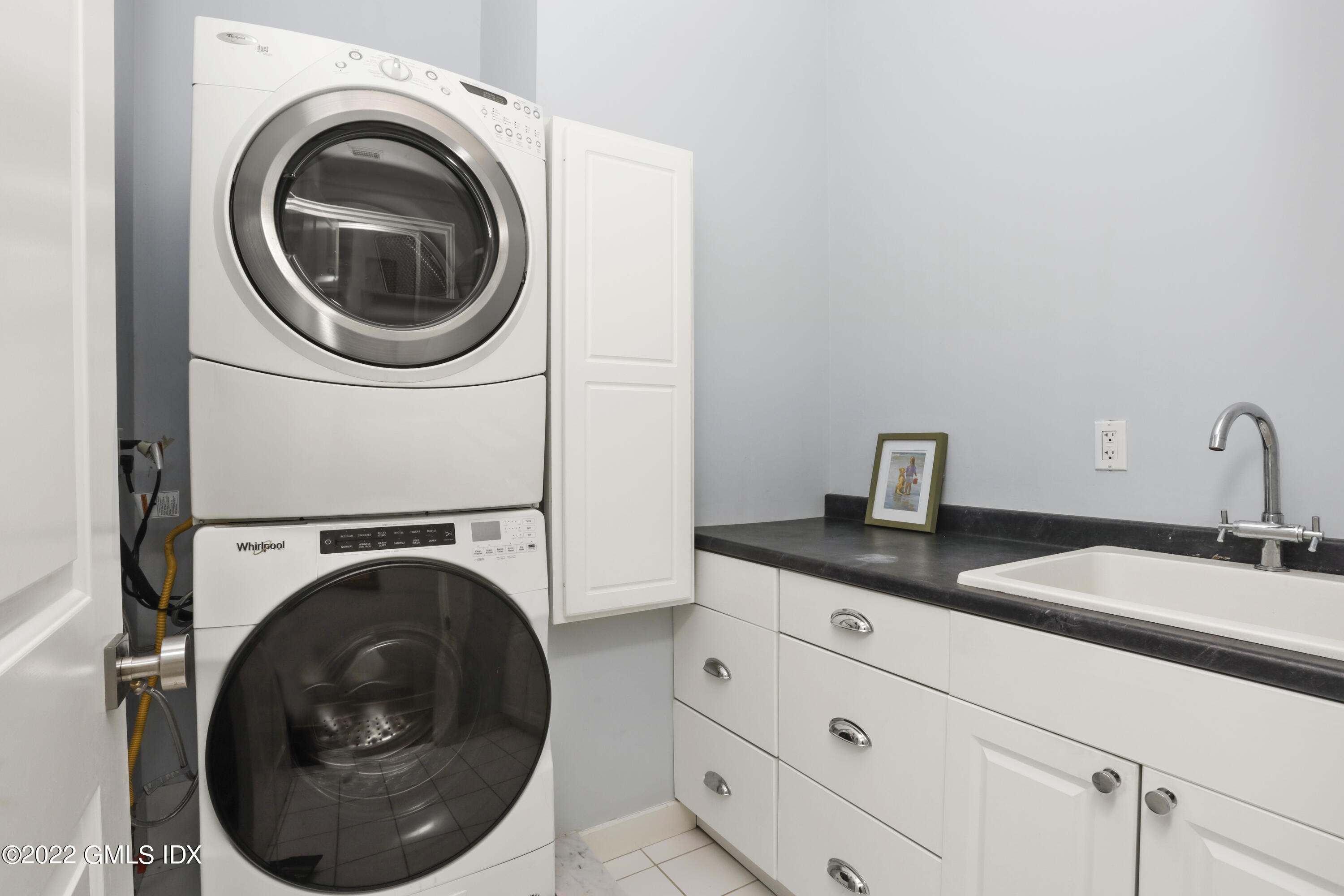 30 Bayside Terrace Riverside, CT 06878 - Photo 40 of 50 a utility room with sink dryer and washer