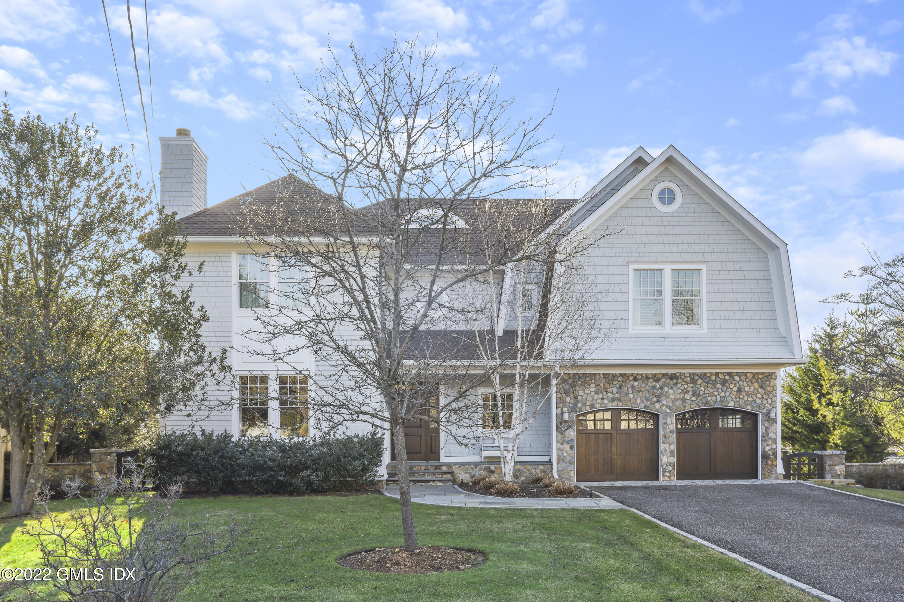 30 Bayside Terrace Riverside, CT 06878 - Photo 44 of 50 a front view of a house with a garden and plants