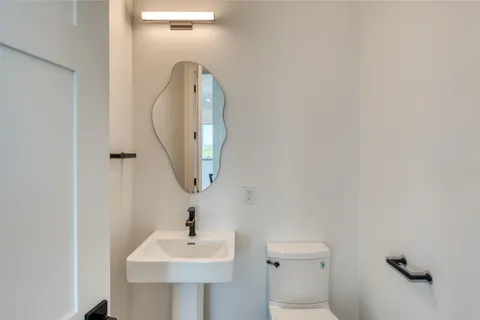 a bathroom with a shower and a sink