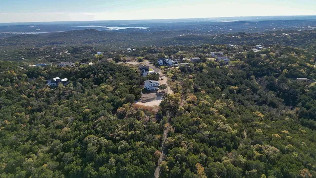 an aerial view of residential houses with city view and mountain view