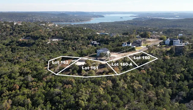 an aerial view of house with yard