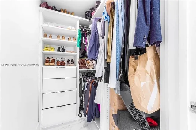 a bathroom with a sink vanity and mirror