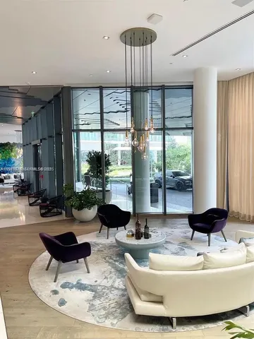 a kitchen with stainless steel appliances kitchen island granite countertop a table and chairs