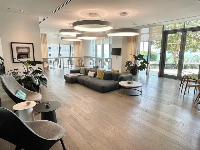 a view of a terrace with lawn chairs