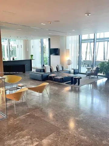 a room with pool table and furniture