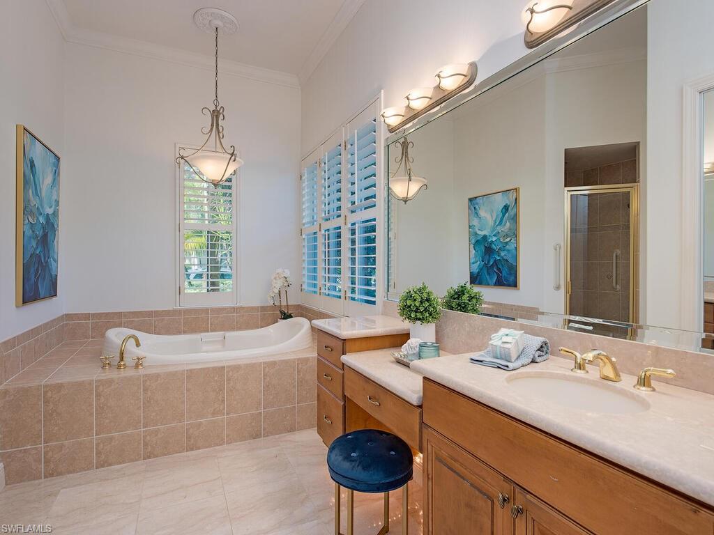 427 Terracina Way Naples, FL 34119 - Photo 15 of 17 Main primary bathwith soaking tub and shower.