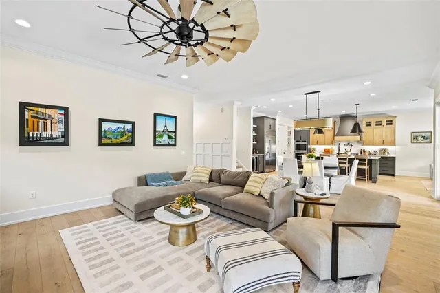 a living room with furniture or couch and a chandelier