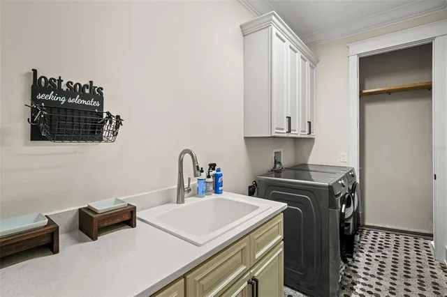 a kitchen that has a sink and a stove