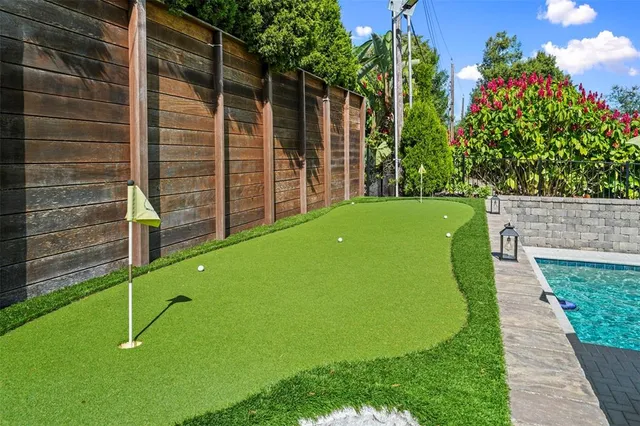 a view of a house with backyard porch and sitting area