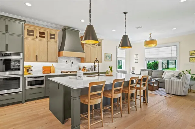 a large kitchen with lots of counter space and windows