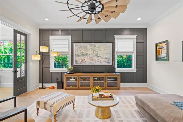 a living room with furniture a window and a table