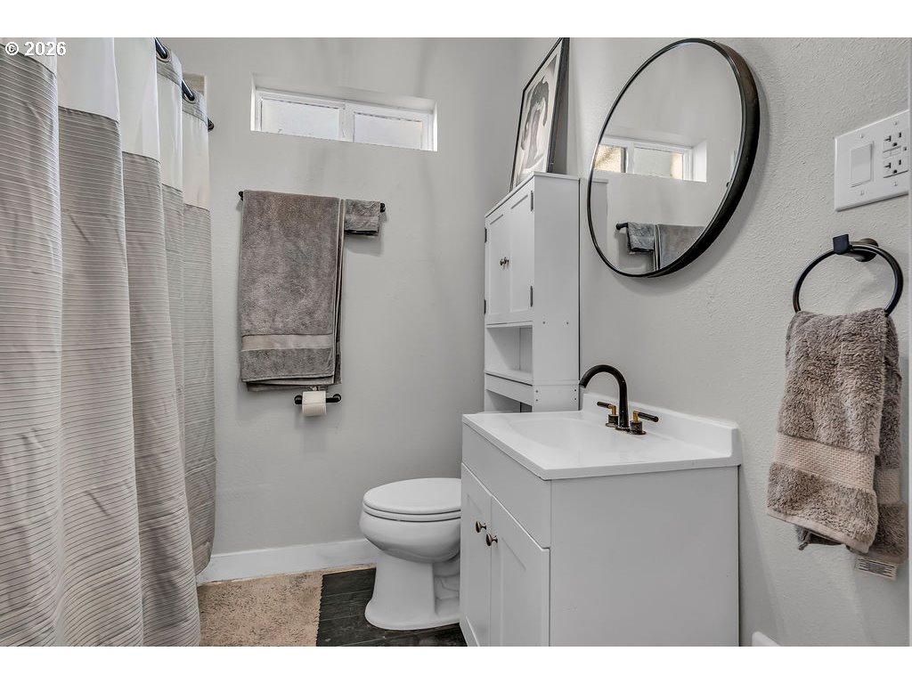 519 West Main Street Sheridan, OR 97378 - Photo 15 of 41 a bathroom with a sink and a mirror
