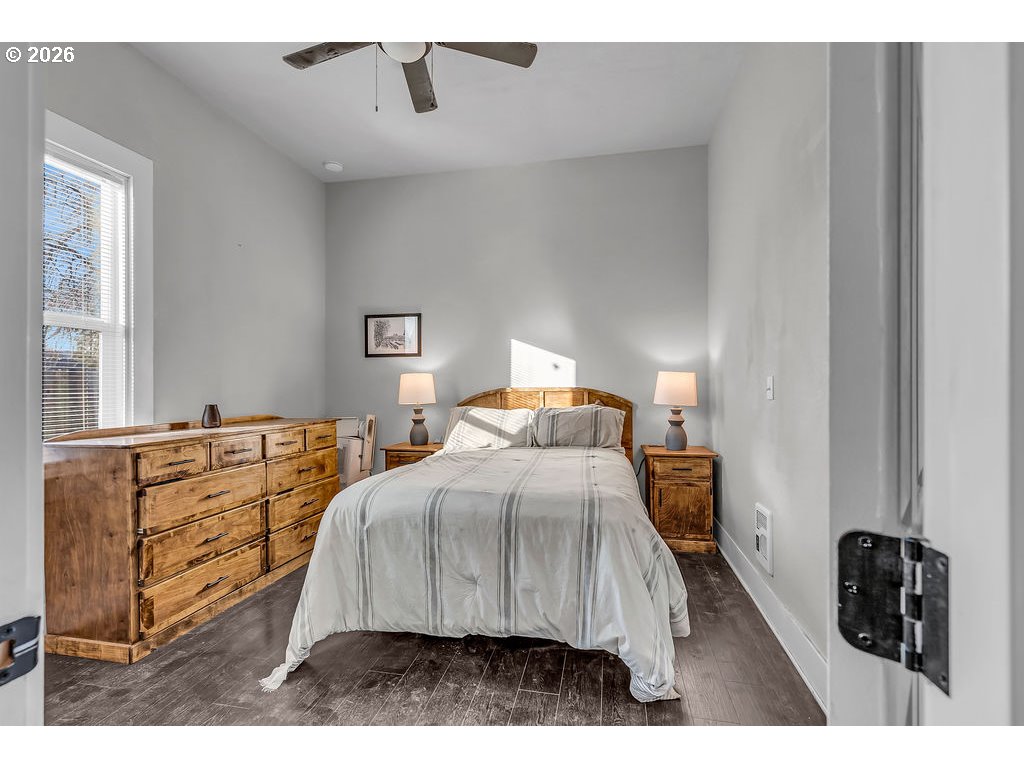 519 West Main Street Sheridan, OR 97378 - Photo 22 of 41 a bedroom with a bed and a walk in closet