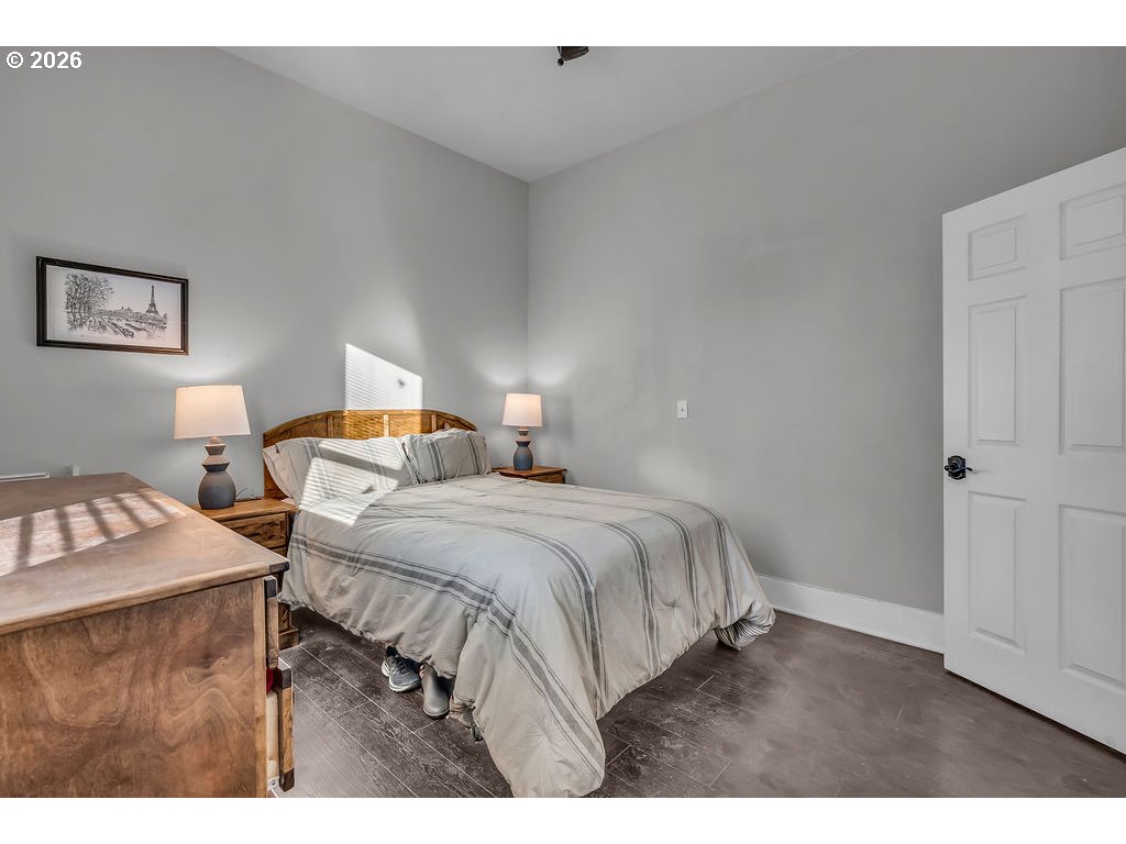 519 West Main Street Sheridan, OR 97378 - Photo 23 of 41 a bedroom with a bed and a desk